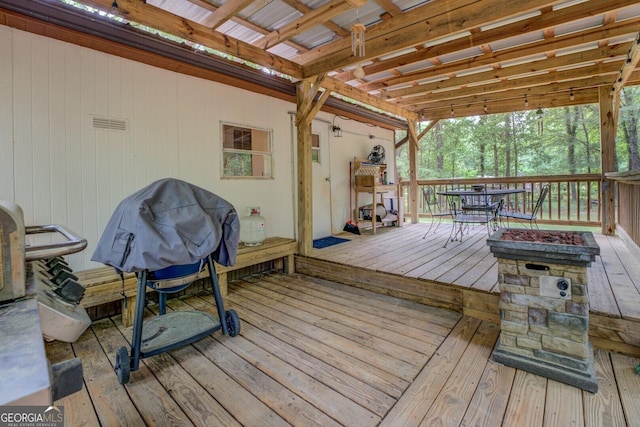 wooden deck featuring outdoor dining space