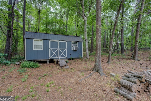 view of shed with fence