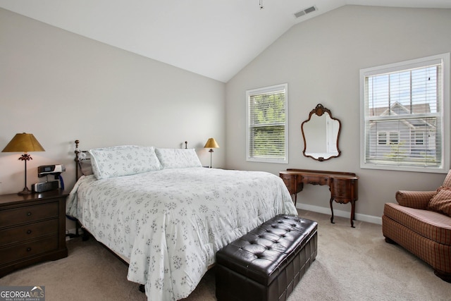 bedroom featuring baseboards, vaulted ceiling, light colored carpet, and visible vents