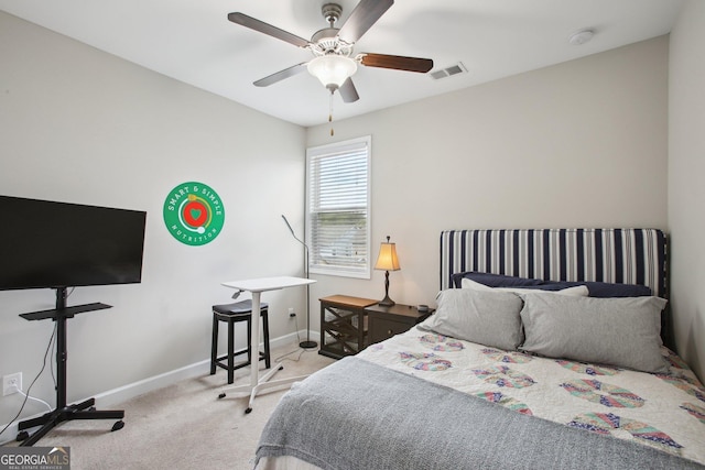carpeted bedroom featuring baseboards, visible vents, and ceiling fan