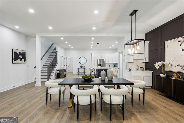 2438 2nd St, Atlanta, GA 30318 - dining space featuring recessed lighting, light wood-style floors, and stairway