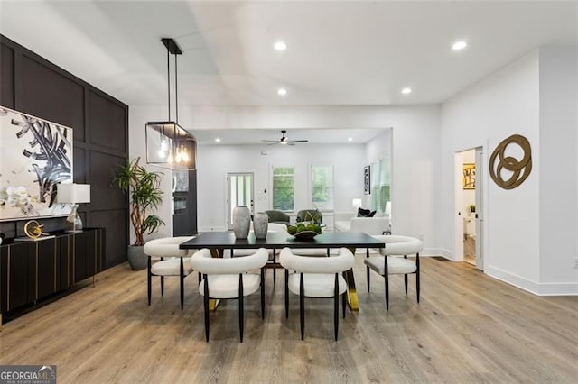 dining space featuring baseboards, recessed lighting, a ceiling fan, and light wood-style flooring