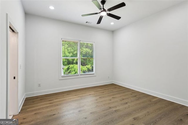 unfurnished bedroom featuring recessed lighting, baseboards, and wood finished floors