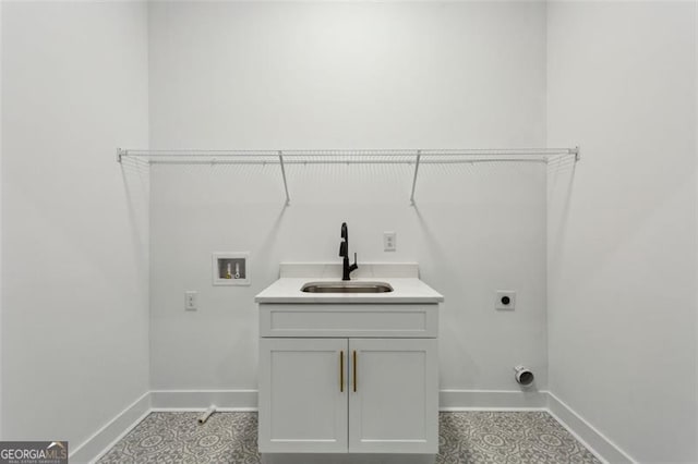 laundry area with a sink, baseboards, hookup for an electric dryer, and hookup for a washing machine