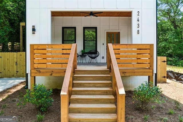 view of exterior entry with board and batten siding