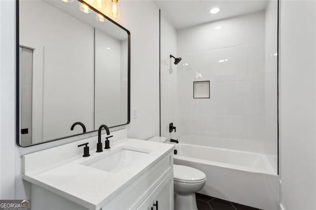 full bath featuring vanity, tile patterned floors, toilet, and tub / shower combination
