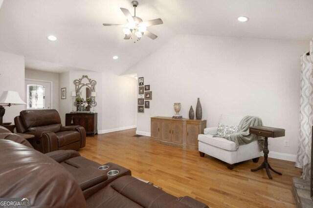 living area with recessed lighting, baseboards, a ceiling fan, and light wood-type flooring
