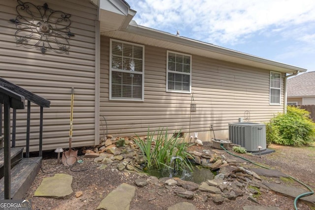 view of home's exterior with cooling unit