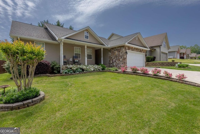craftsman house with covered porch, an attached garage, concrete driveway, and a front yard