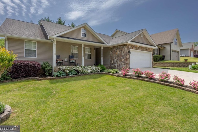 craftsman house with a garage, concrete driveway, a porch, and a front yard