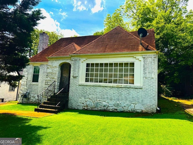 1624 Beecher St SW, Atlanta, GA 30310 - view of front of home featuring a chimney, stone siding, and a front lawn