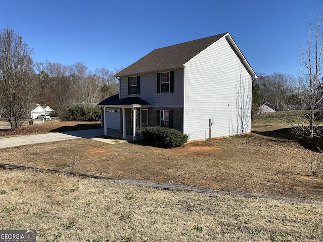 view of front of home featuring a garage, driveway, and brick siding
