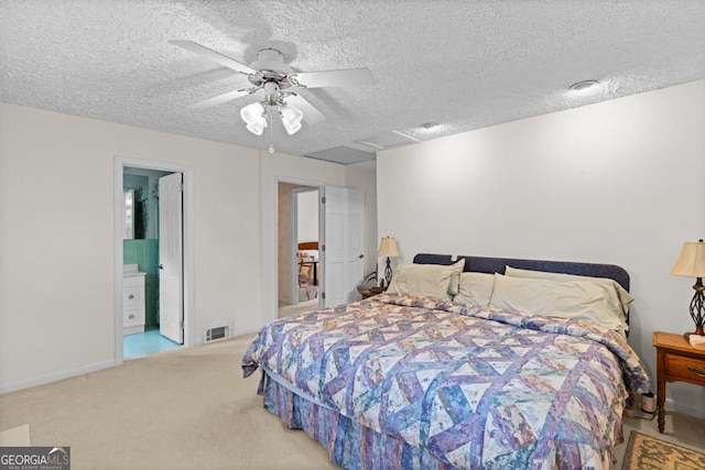 bedroom featuring visible vents, a ceiling fan, a textured ceiling, and carpet floors