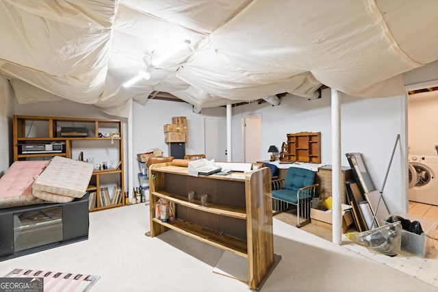 finished basement featuring washer / clothes dryer and carpet