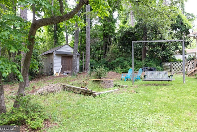 view of yard with a storage unit and an outbuilding