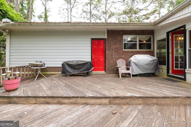 wooden deck featuring grilling area