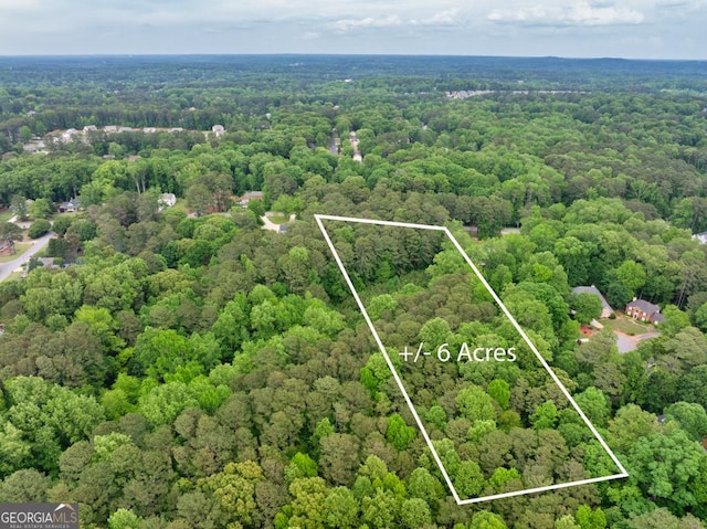 aerial view with a wooded view