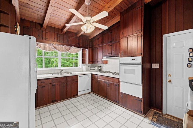 kitchen with a sink, white appliances, wooden ceiling, beamed ceiling, and a warming drawer