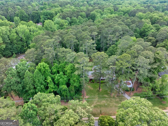 birds eye view of property with a wooded view
