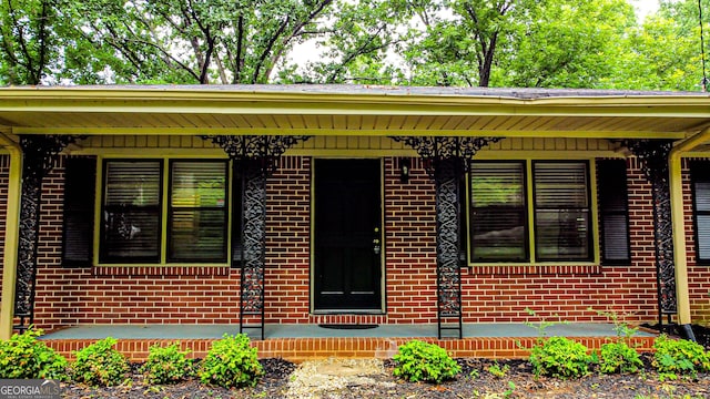 6470 Sherwood Trl, Austell, GA 30168 - doorway to property featuring brick siding