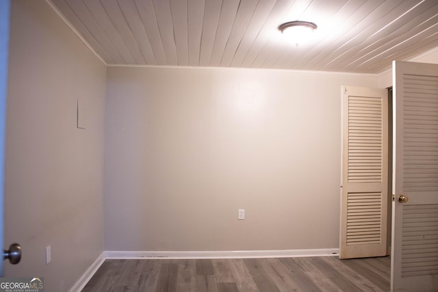 6470 Sherwood Trl, Austell, GA 30168 - unfurnished room with ornamental molding, wooden ceiling, and wood finished floors