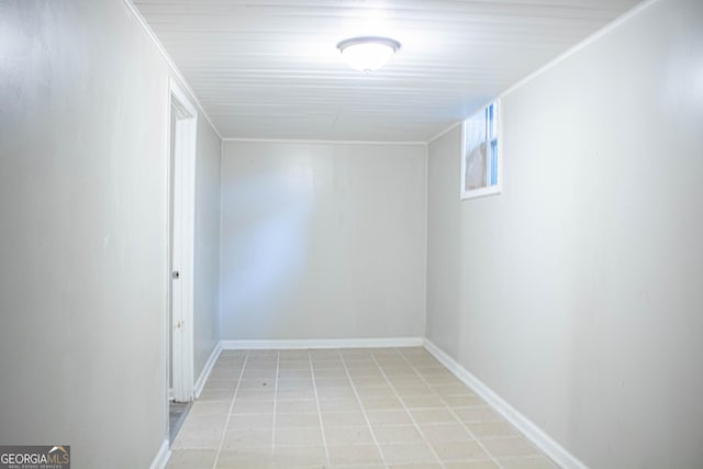 basement with light tile patterned floors and baseboards