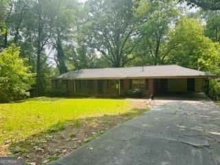 6470 Sherwood Trl, Austell, GA 30168 - ranch-style home with driveway, a front lawn, and an attached carport