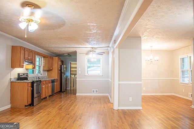 6470 Sherwood Trl, Austell, GA 30168 - kitchen with appliances with stainless steel finishes, a textured ceiling, ceiling fan, under cabinet range hood, and brown cabinets