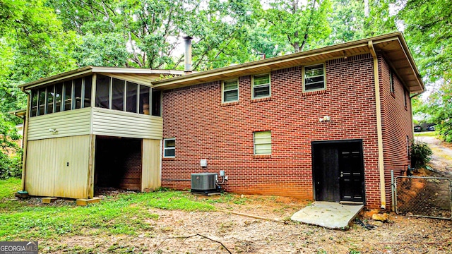 6470 Sherwood Trl, Austell, GA 30168 - rear view of house featuring a sunroom and view of scattered trees