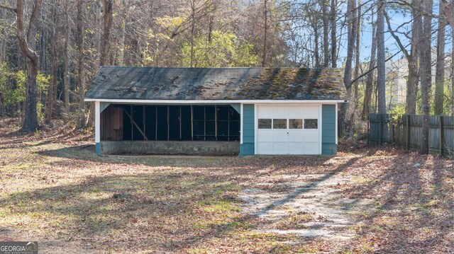 garage with fence