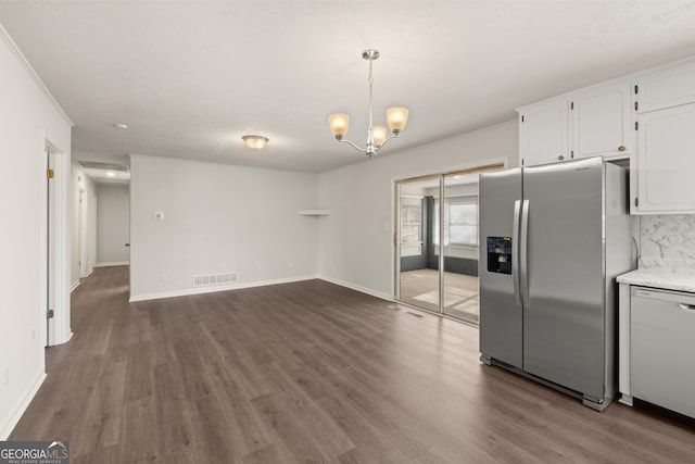 kitchen featuring visible vents, wood finished floors, white cabinetry, stainless steel fridge with ice dispenser, and dishwasher