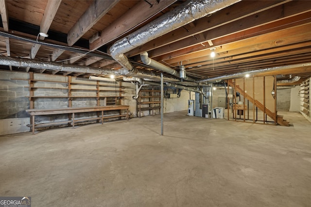 unfinished below grade area featuring electric water heater