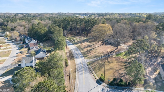 bird's eye view featuring a wooded view