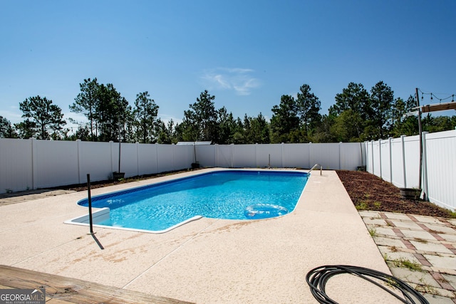 view of pool with a patio, a fenced in pool, and a fenced backyard