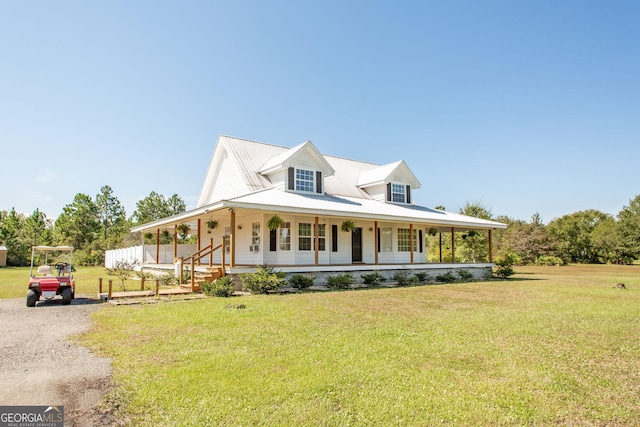 view of front of house with covered porch and a front yard