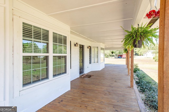 wooden deck featuring covered porch