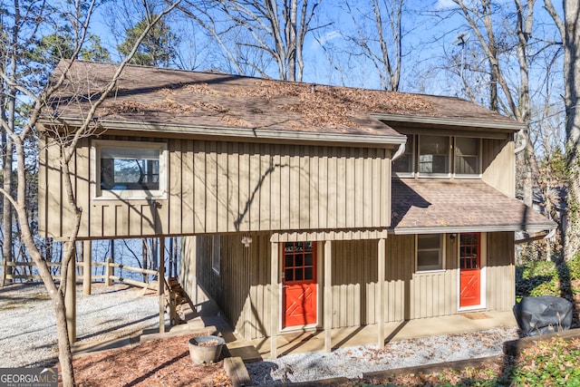 view of front of property featuring roof with shingles