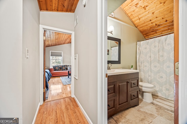 bathroom featuring wood ceiling, visible vents, vanity, toilet, and lofted ceiling