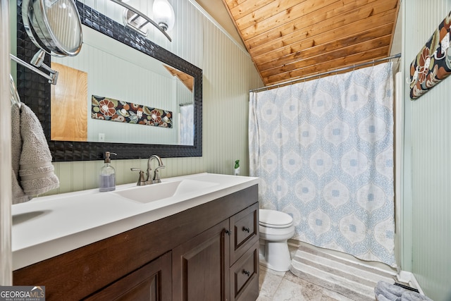 bathroom featuring a shower with curtain, vaulted ceiling, vanity, toilet, and wallpapered walls