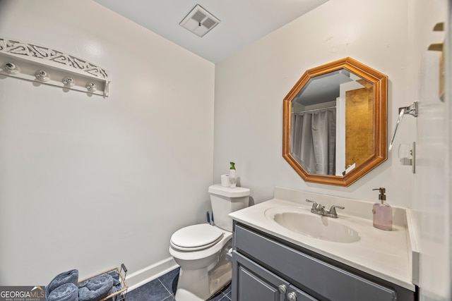 bathroom featuring tile patterned flooring, vanity, toilet, baseboards, and visible vents