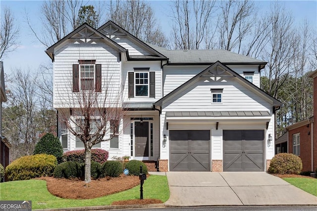view of front of house featuring a standing seam roof, an attached garage, concrete driveway, and brick siding