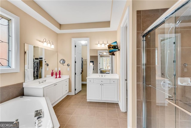 full bath with vanity, tile patterned floors, and a stall shower