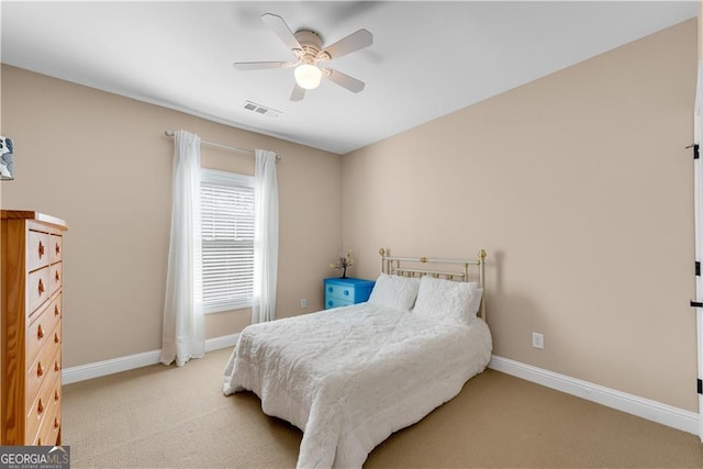 bedroom featuring baseboards, visible vents, ceiling fan, and carpet