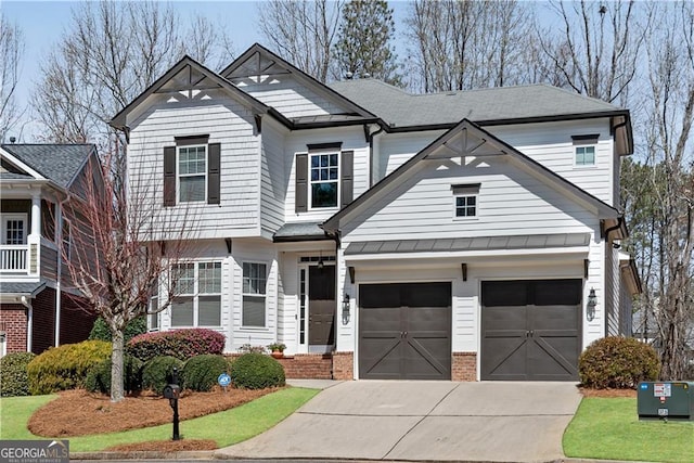 view of front of home featuring an attached garage, metal roof, a standing seam roof, and concrete driveway