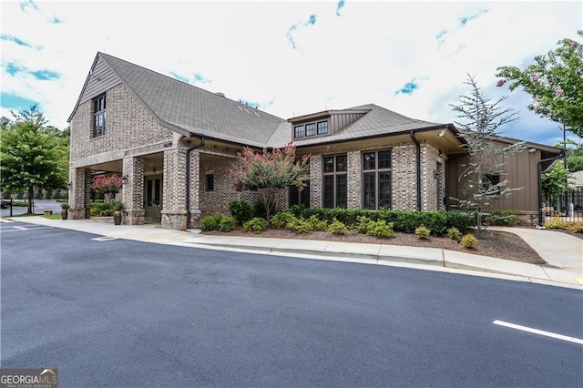 view of home's exterior with brick siding