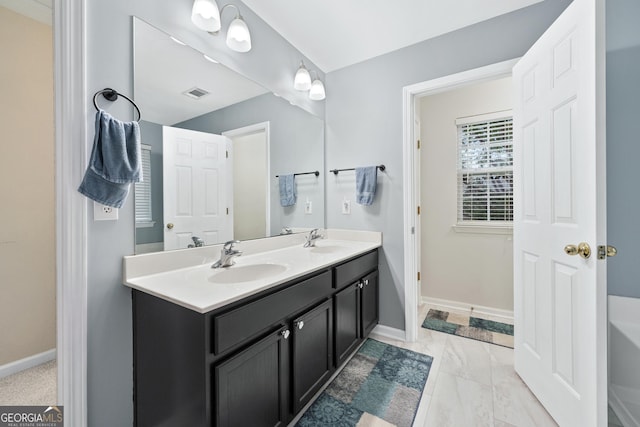 449 Highlands Loop, Woodstock, GA 30188 - full bathroom featuring double vanity, a tub to relax in, and baseboards