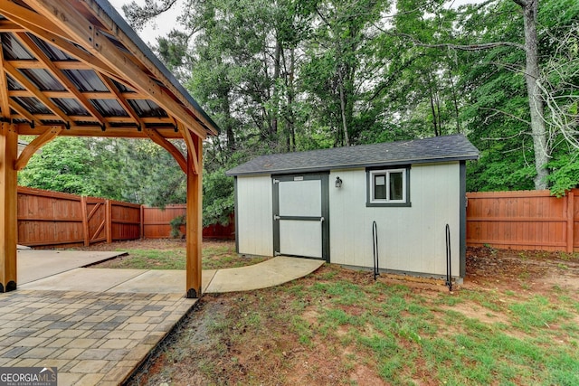 view of shed featuring a fenced backyard