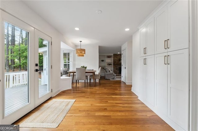 hallway featuring recessed lighting and light wood-style floors