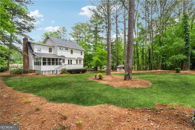 view of yard with a sunroom