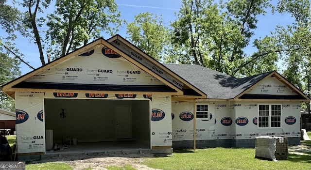 property under construction featuring roof with shingles